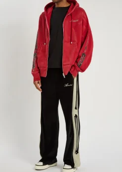 Amiri Bones appliquéd velour track pants