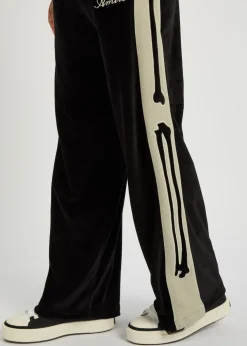 Amiri Bones appliquéd velour track pants