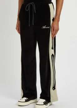 Amiri Bones appliquéd velour track pants
