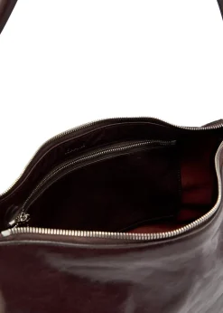 Belted baguette leather shoulder bag