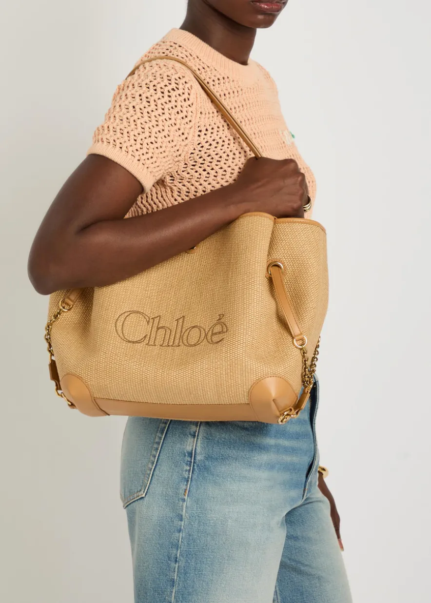 Clover logo-embroidered raffia tote bag