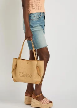Clover logo-embroidered raffia tote bag