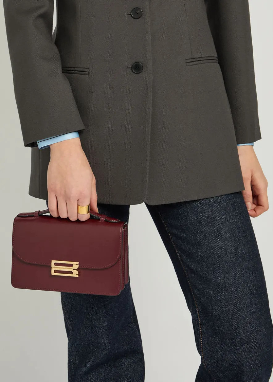 Dorian mini grained-leather top handle bag