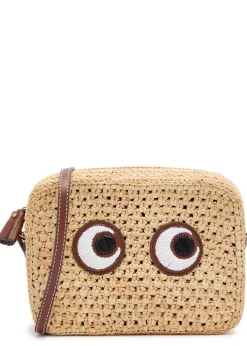 Eyes appliquéd raffia cross-body bag