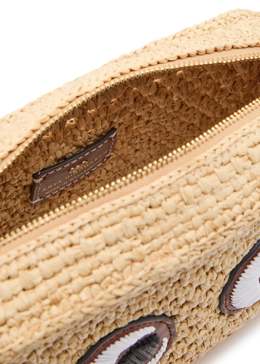 Eyes appliquéd raffia cross-body bag