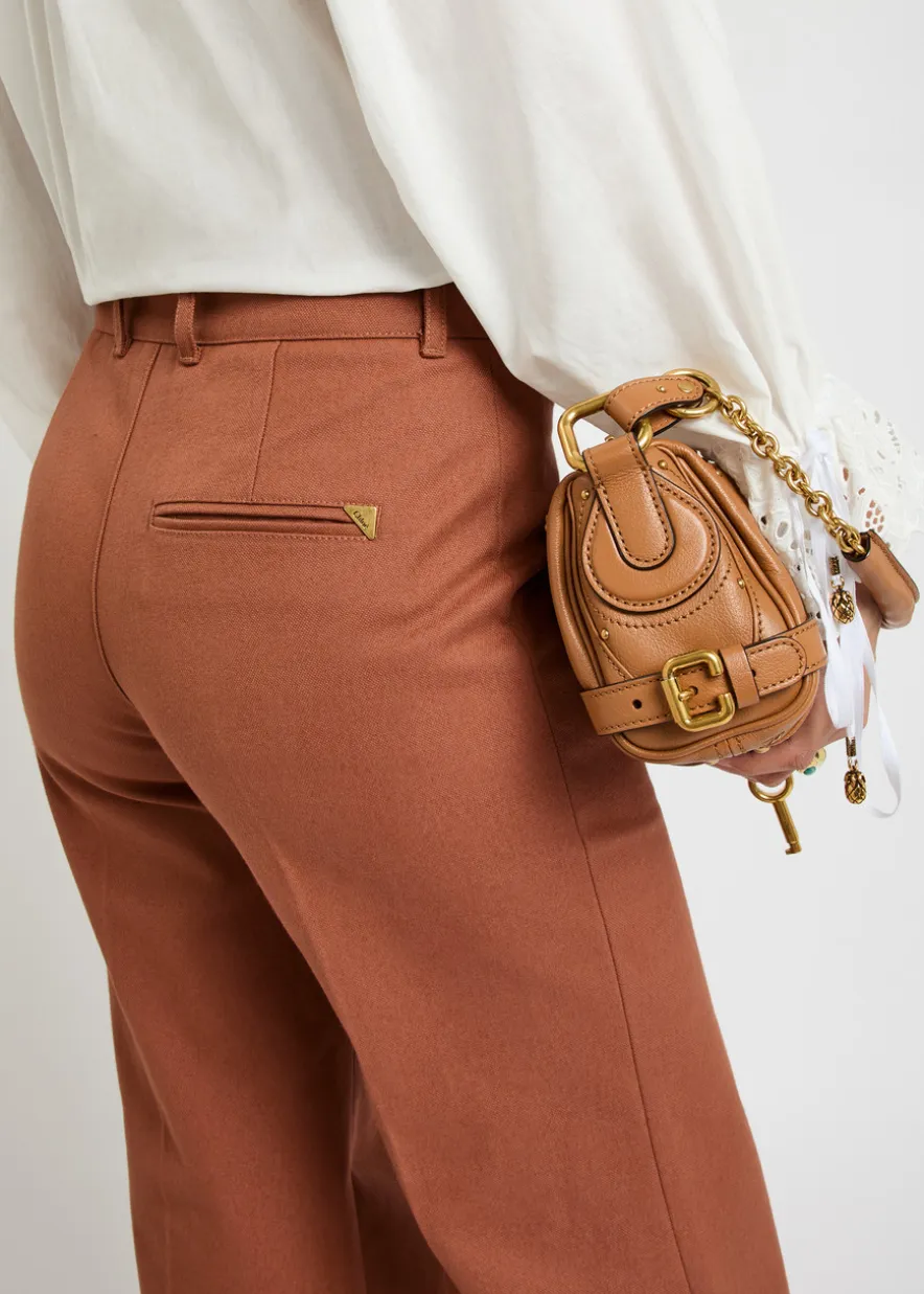 Flared-leg canvas trousers