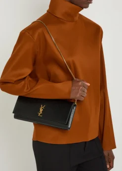 Kate logo pebbled leather clutch
