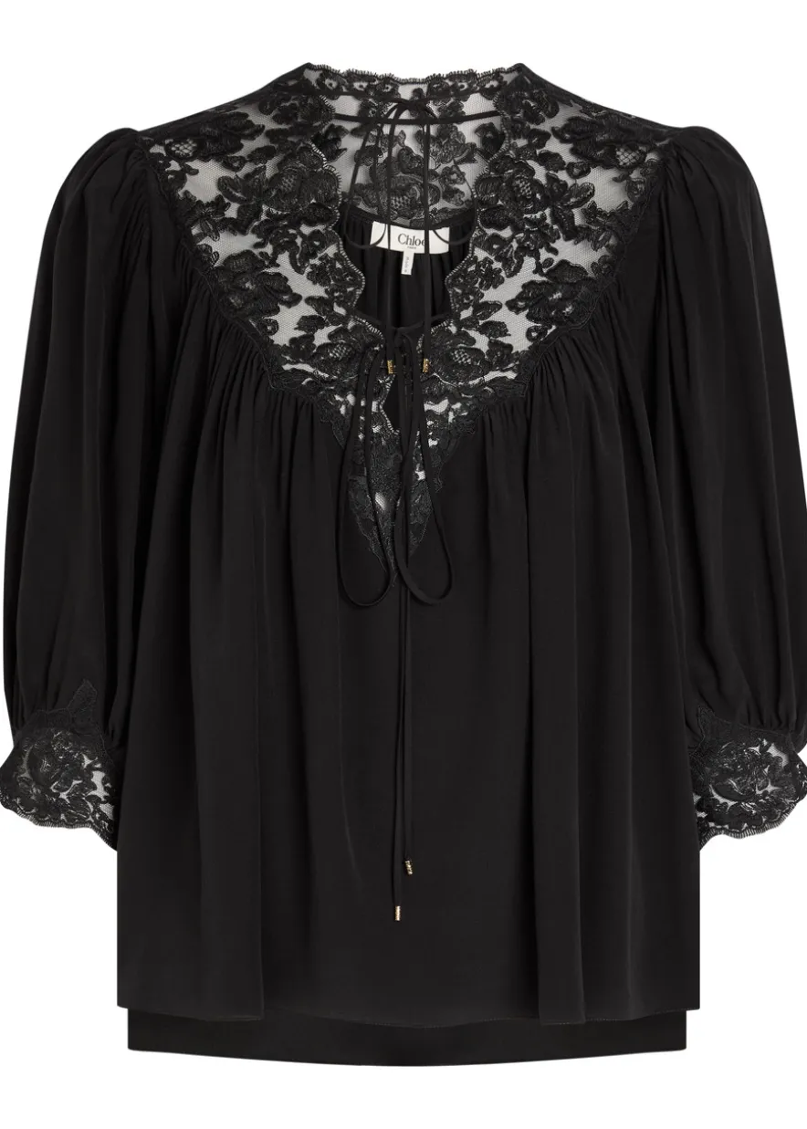 Lace-trimmed silk blouse