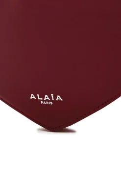 Le Coeur patent leather cross-body bag