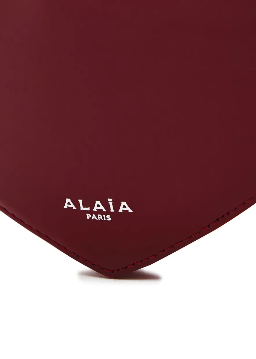 Le Coeur patent leather cross-body bag