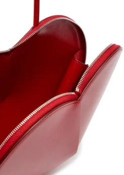 Le Couer glossed leather cross-body bag