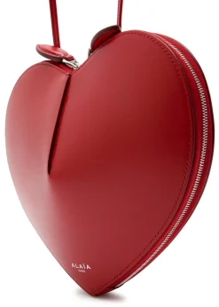 Le Couer glossed leather cross-body bag