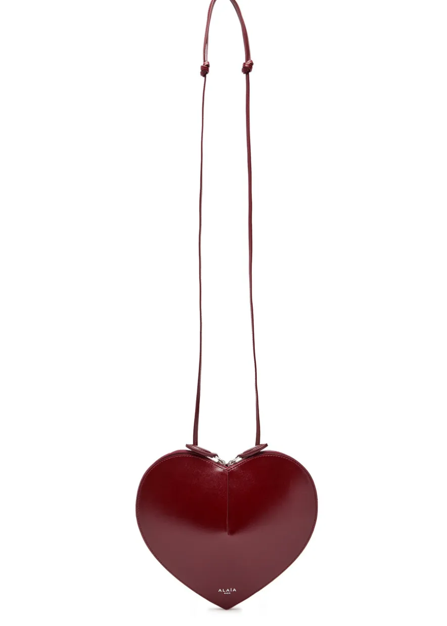 Le Couer glossed leather cross-body bag