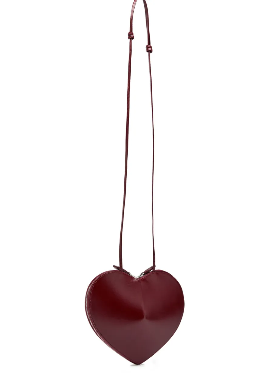 Le Couer glossed leather cross-body bag