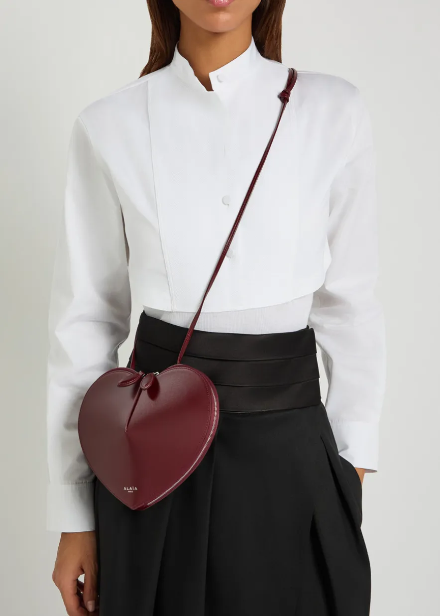 Le Couer glossed leather cross-body bag