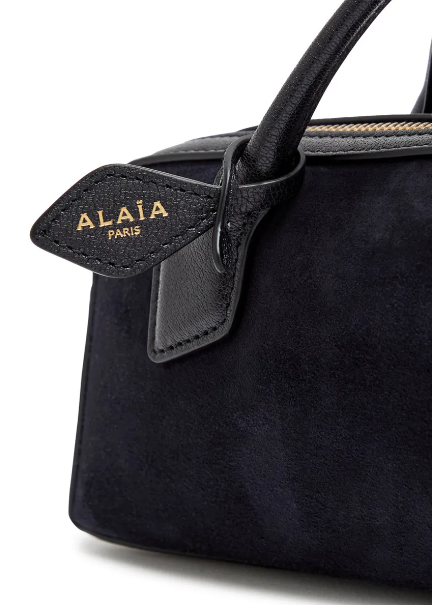 Le Teckel suede clutch