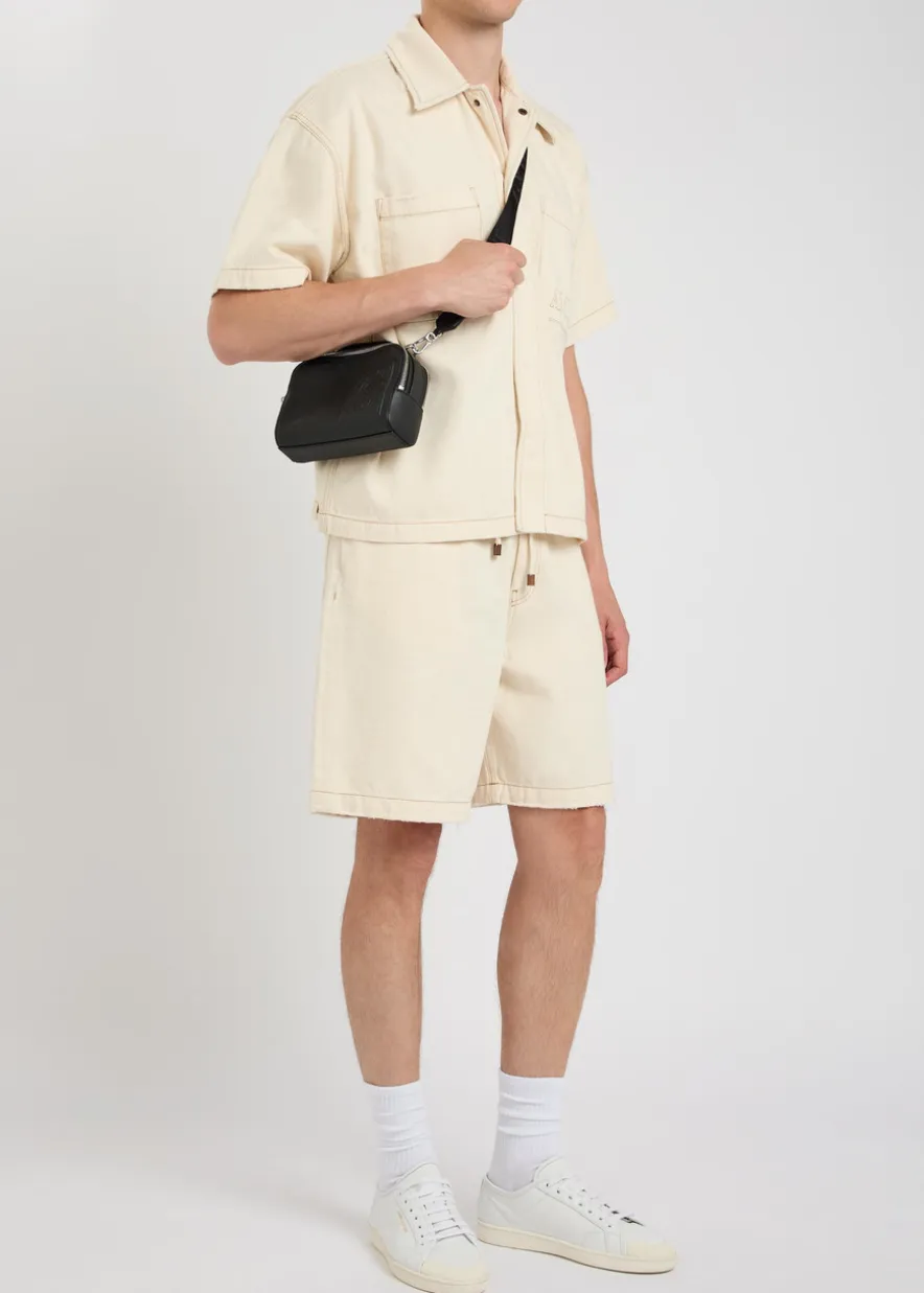 Logo-embossed distressed denim shorts