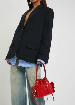 Multipocket mini patent leather bucket bag