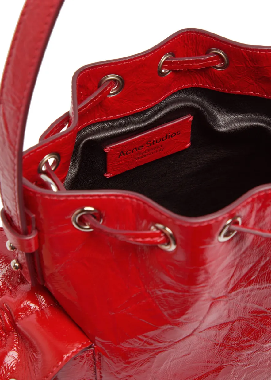 Multipocket mini patent leather bucket bag