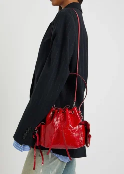 Multipocket mini patent leather bucket bag