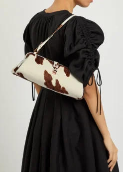 Paola cow-print calf-hair clutch