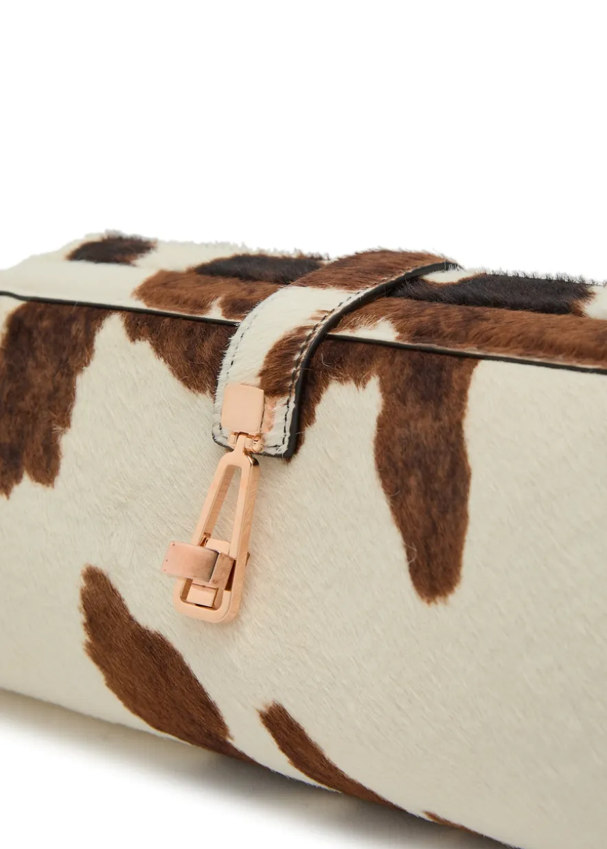 Paola cow-print calf-hair clutch
