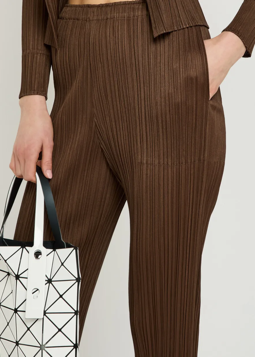 Pleated tapered-leg woven trousers