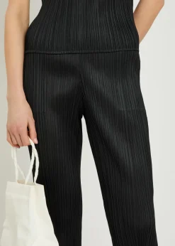 Pleated tapered-leg woven trousers