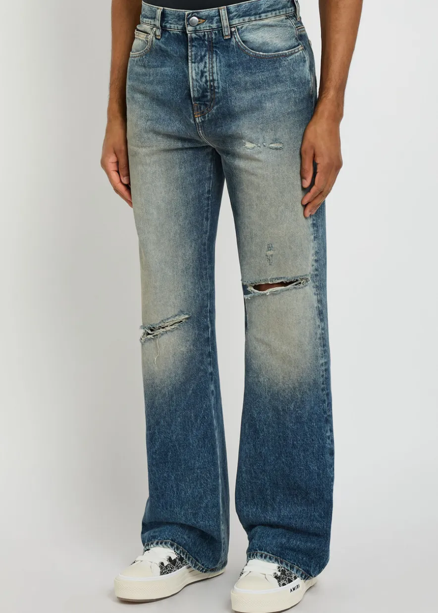 Slashed distressed bootcut jeans