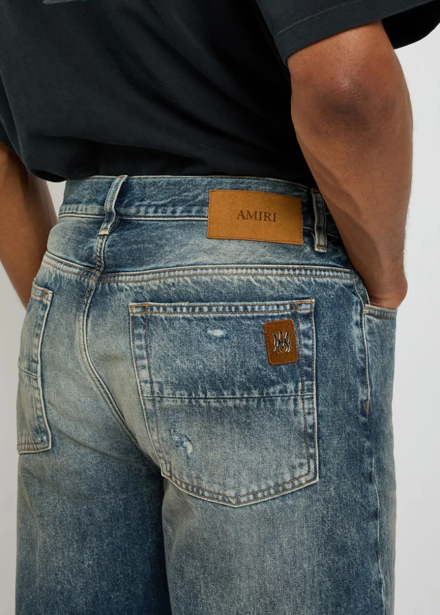 Slashed distressed bootcut jeans