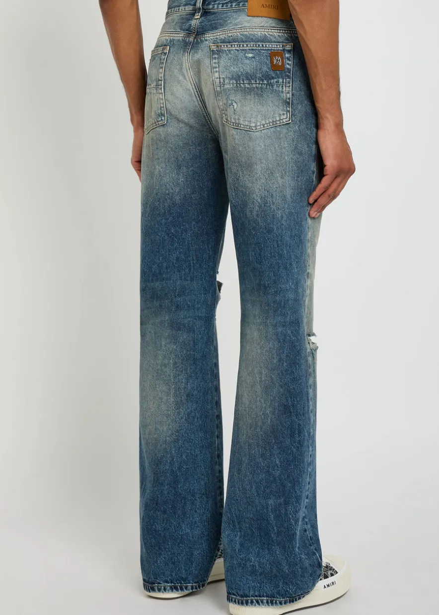 Slashed distressed bootcut jeans