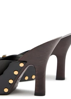 105 stud-embellished wooden and patent leather mules
