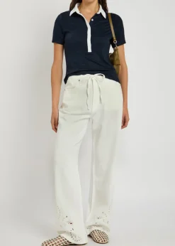 The Knit Button stretch-knit polo top
