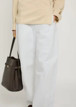 Twisted belted barrel-leg jeans