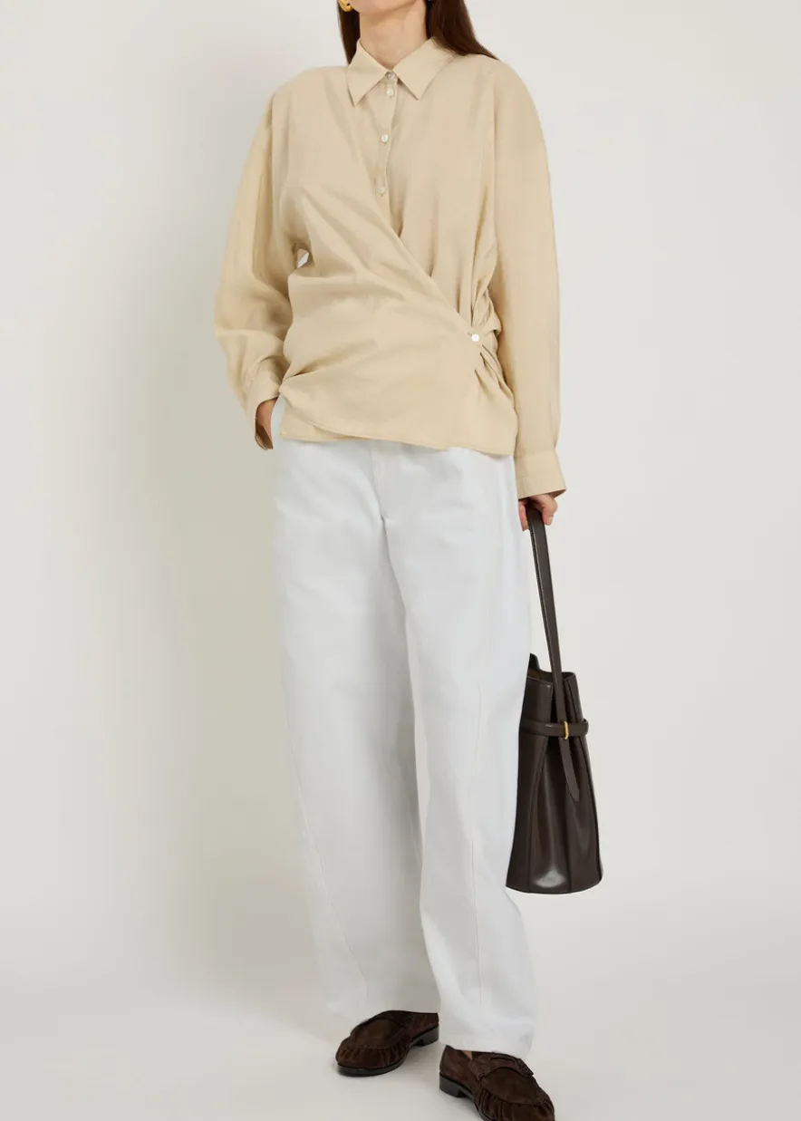 Twisted belted barrel-leg jeans
