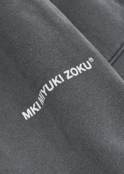 Uniform logo-print cotton-blend sweatpants