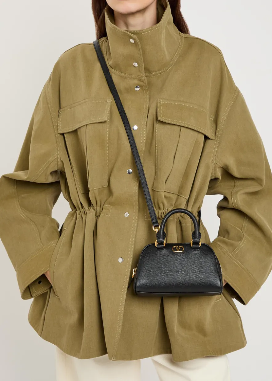 VLogo mini pebbled leather top handle bag